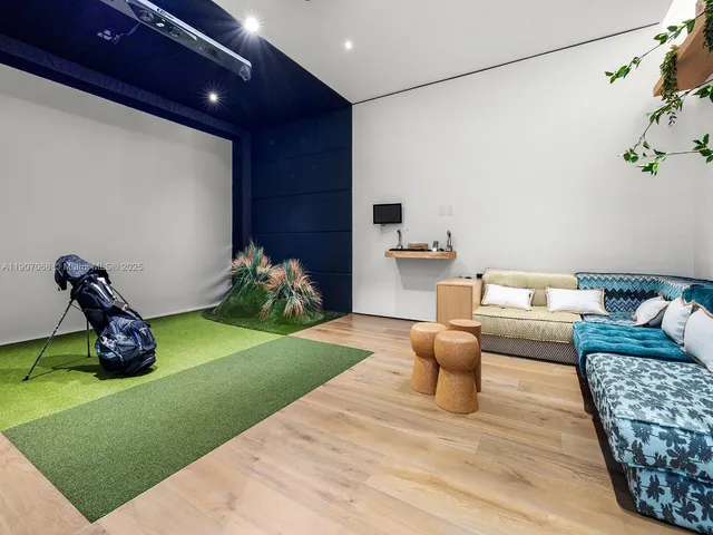 a living room with furniture and a rug