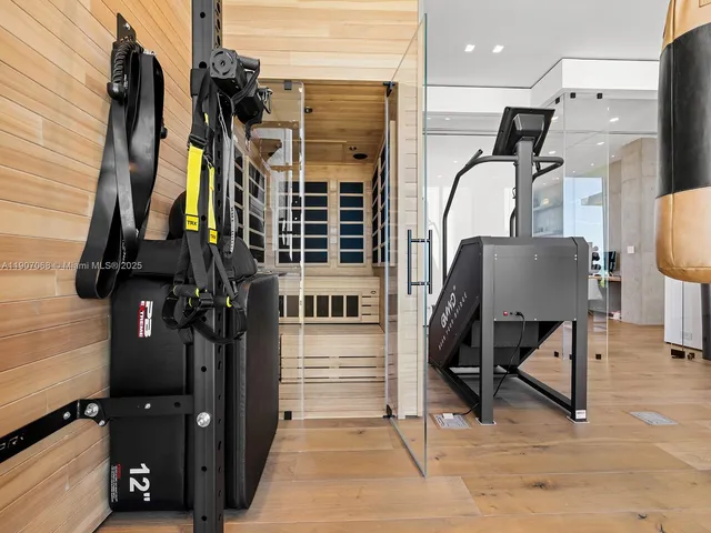 wooden floor with a view of a living room and bathroom