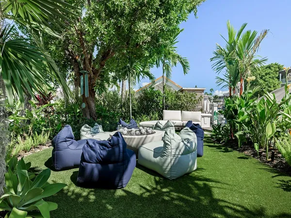 a view of a chairs and table in the patio