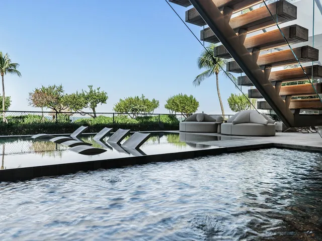 a view of swimming pool with seating area