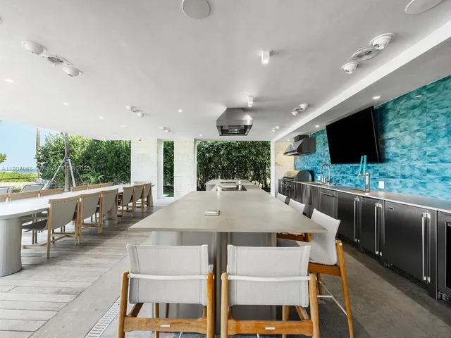 a kitchen with a table and chairs in it