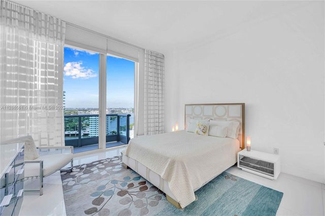 a bathroom with a double vanity sink mirror and toilet