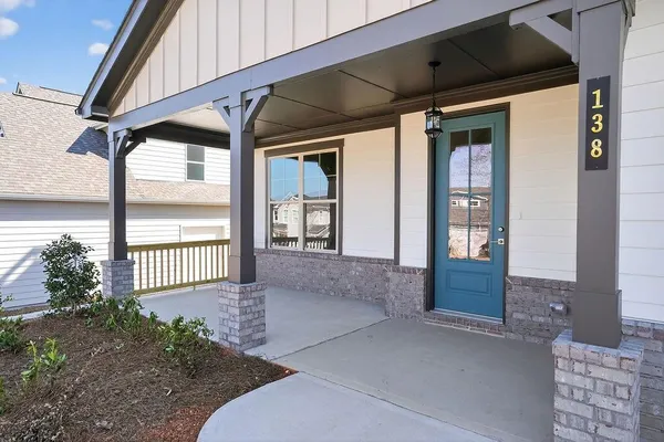a view of a livingroom with a ceiling fan and hardwood floor