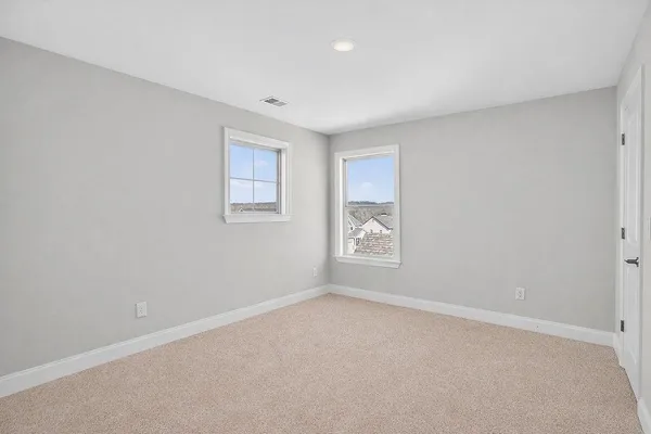 a view of swimming pool with a yard in front of it