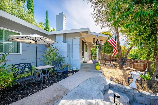 a view of outdoor sitting area with chairs