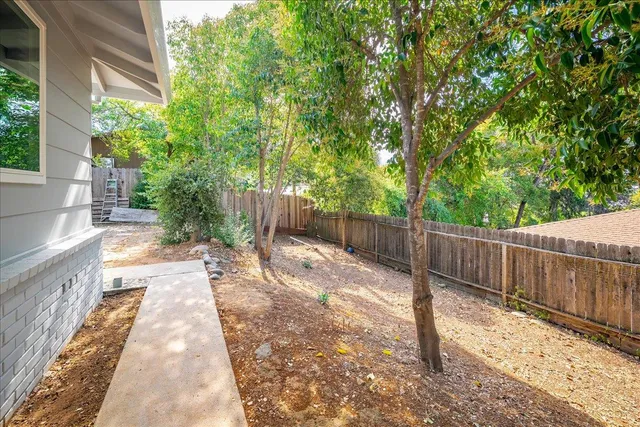 a view of a street with a bench