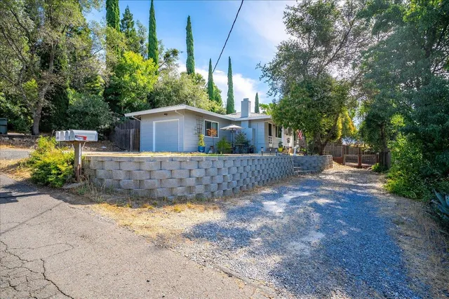 a view of backyard with outdoor seating