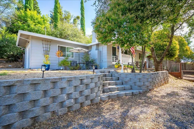 a view of house with outdoor seating