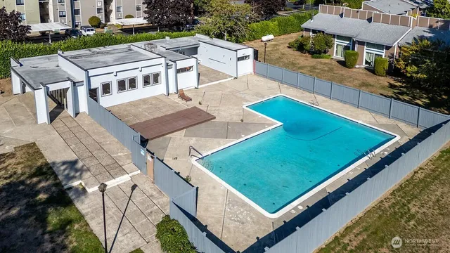 an aerial view of a house with pool