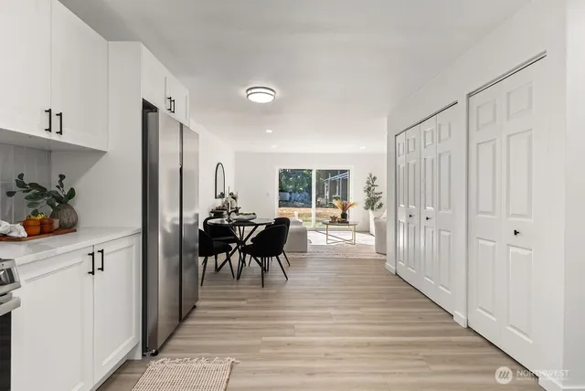 a view of a dining room with furniture window and wooden floor