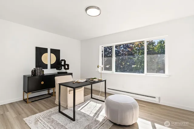 a bedroom with furniture and a window