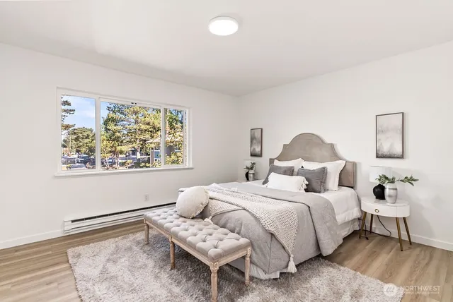 a bedroom with a bed and a window