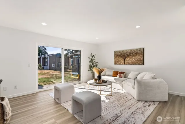 a living room with furniture and a large window