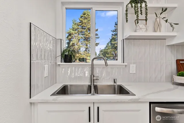 a kitchen with a sink and a window