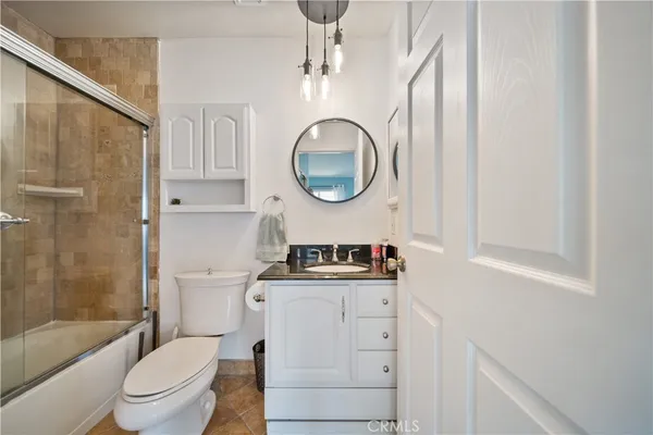 a bathroom with a toilet a sink and bathtub