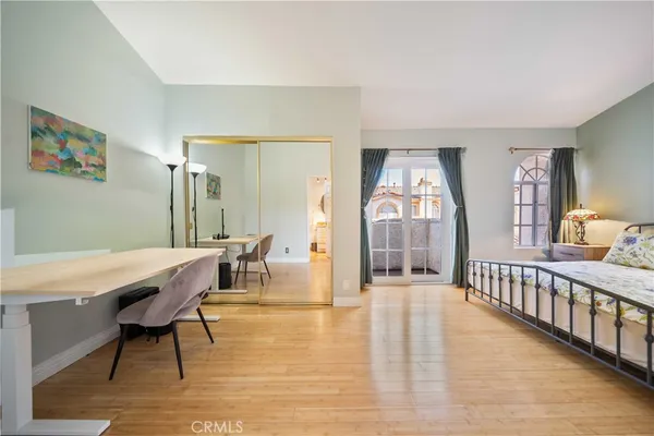a view of a livingroom with furniture wooden floor a chandelier