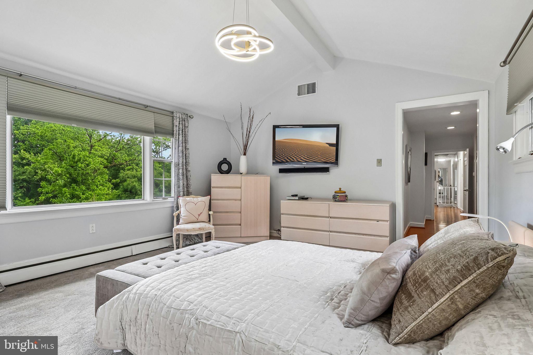 1223 Hagys Ford Road Penn Valley, PA 19072 - Photo 38 of 70 a bedroom with a bed and a flat screen tv