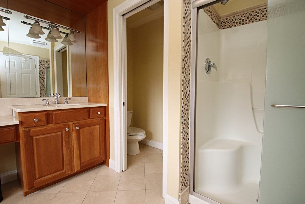 56 Main Street Boxford, MA 01921 - Photo 23 of 42 a bathroom with a sink a toilet and shower