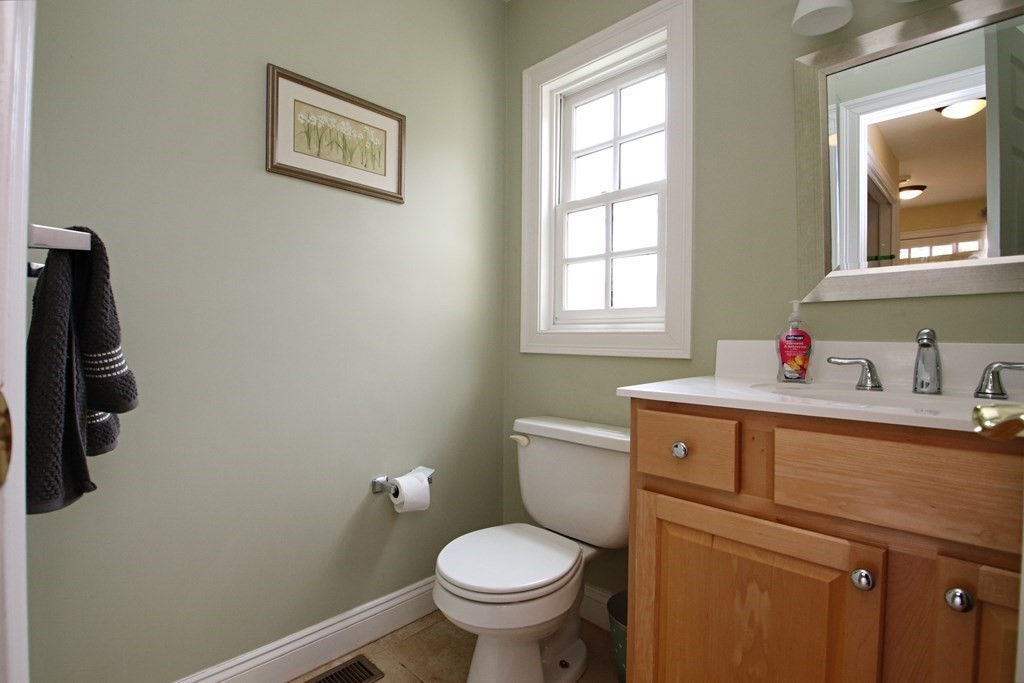 56 Main Street Boxford, MA 01921 - Photo 25 of 42 a bathroom with a toilet sink and window
