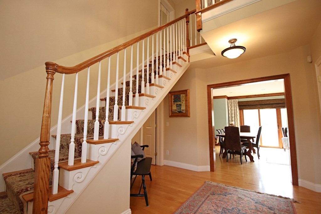 56 Main Street Boxford, MA 01921 - Photo 26 of 42 a view of entryway and dining room with wooden floor