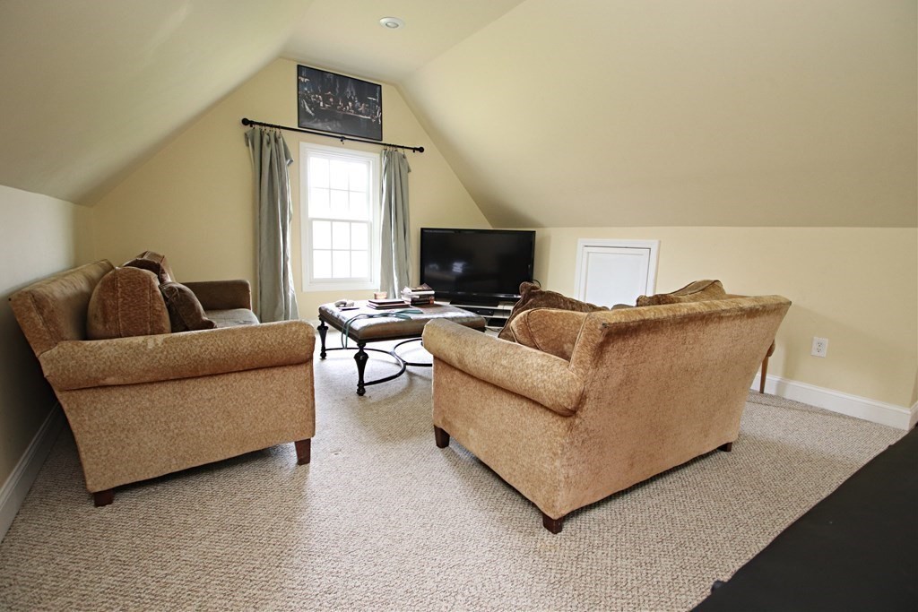 56 Main Street Boxford, MA 01921 - Photo 33 of 42 a living room with furniture and a flat screen tv