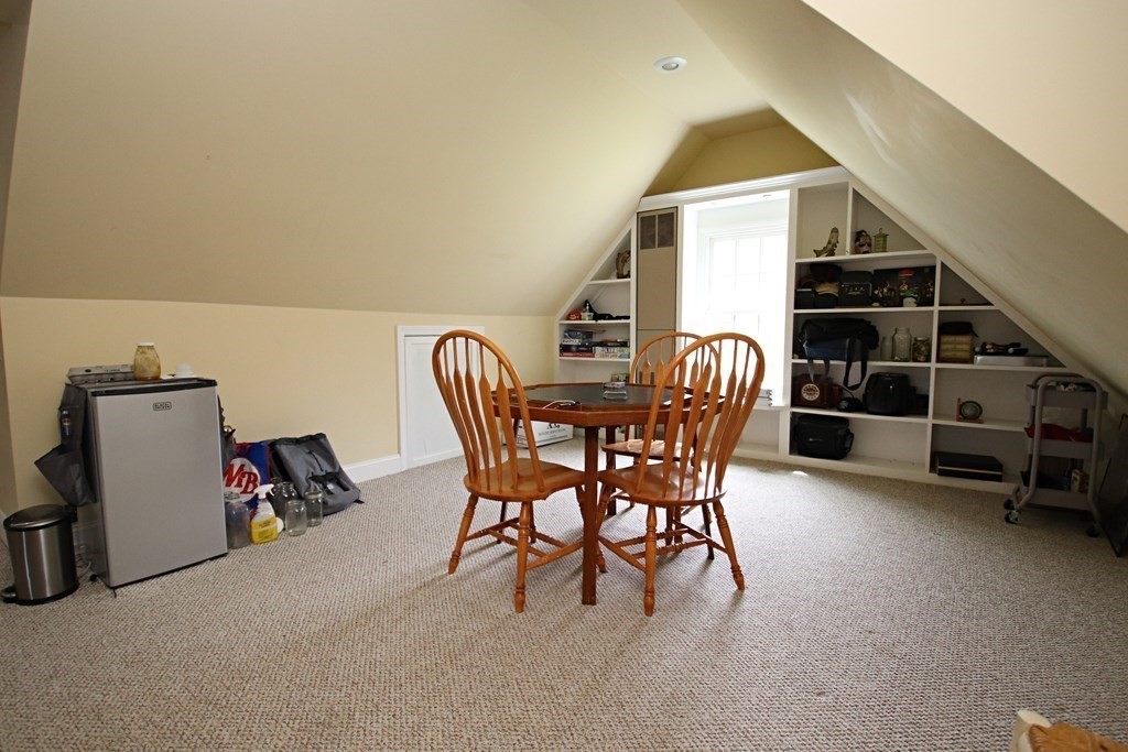 56 Main Street Boxford, MA 01921 - Photo 34 of 42 a dining room with furniture and a book shelf
