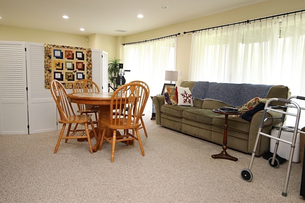 56 Main Street Boxford, MA 01921 - Photo 36 of 42 a living room with furniture and a large window