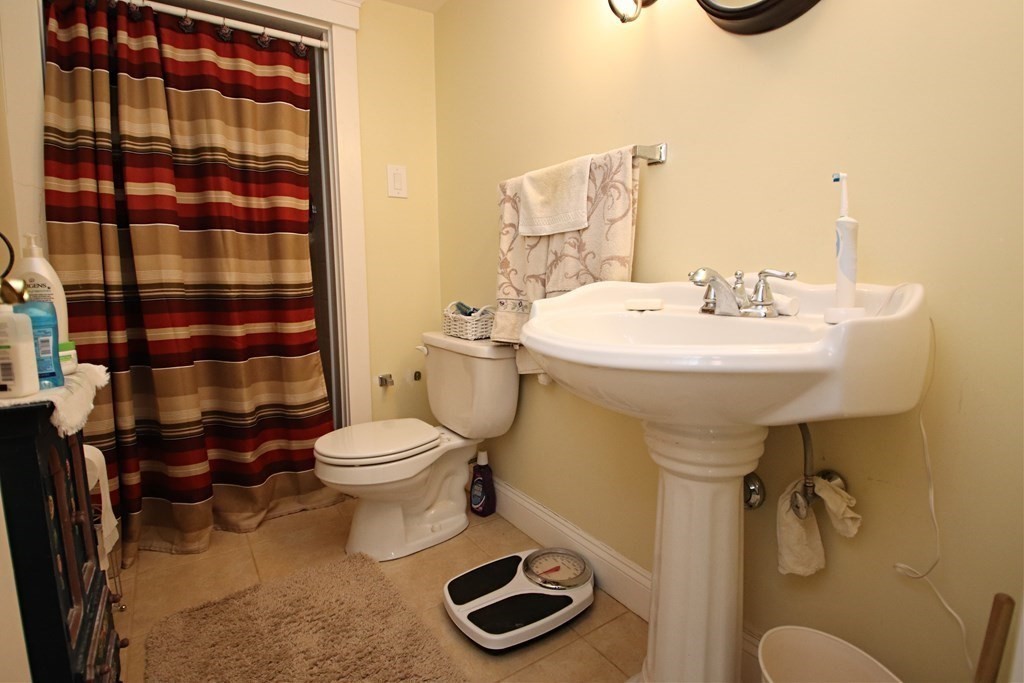 56 Main Street Boxford, MA 01921 - Photo 38 of 42 a bathroom with a sink a toilet and shower