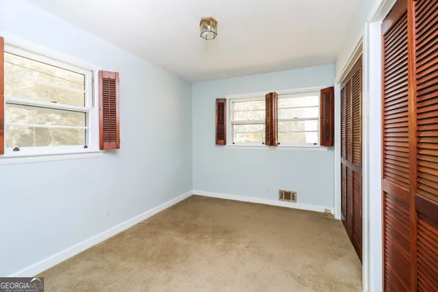 an empty room with windows