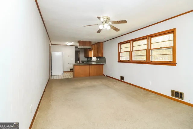 a room with window and ceiling fan