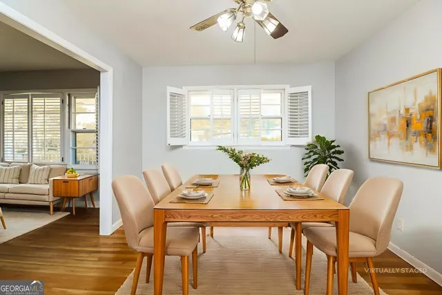 a view of a dining room with furniture window and outside view