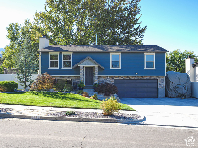 3308 Willow Ridge Road Salt Lake City, UT 84121 - Photo 1 of 59 Blue horizontal siding with stone veneer accents