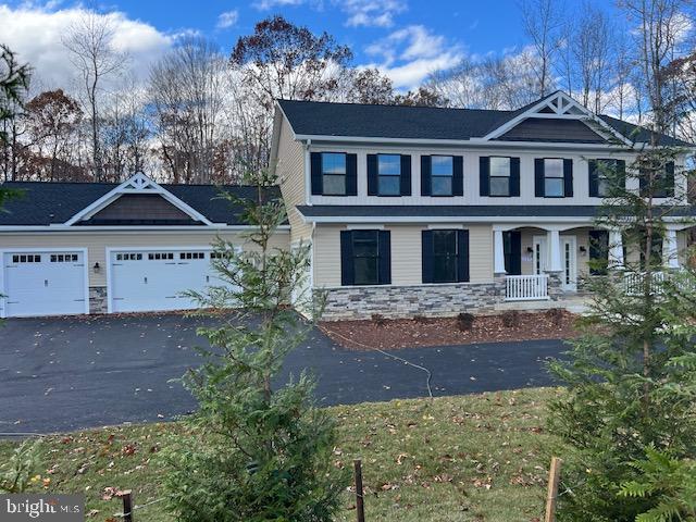 119 Juggins Road Stafford, VA 22556 - Photo 1 of 46 a front view of a house with a yard
