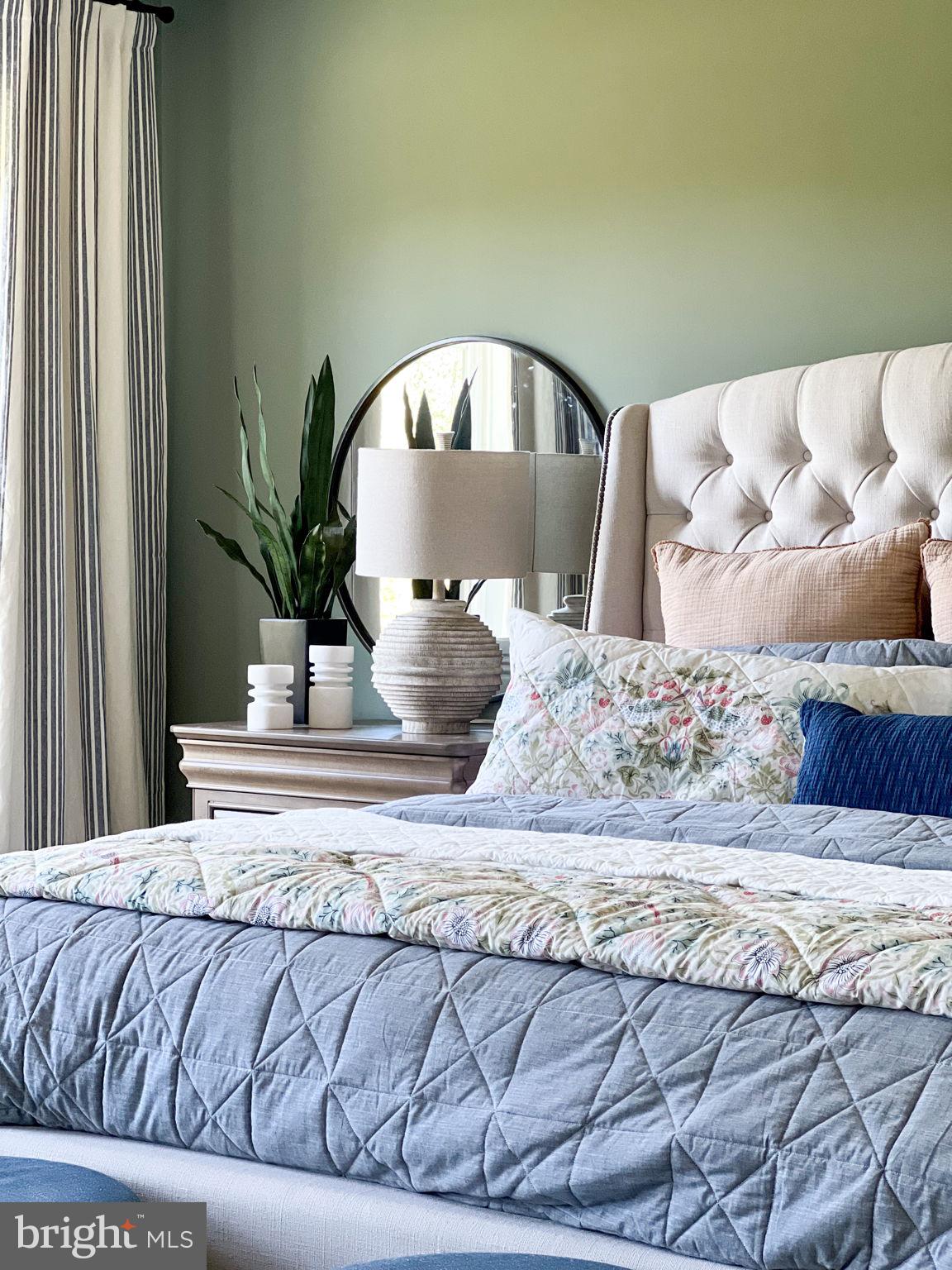 119 Juggins Road Stafford, VA 22556 - Photo 20 of 46 a bedroom with a large bed and a potted plant