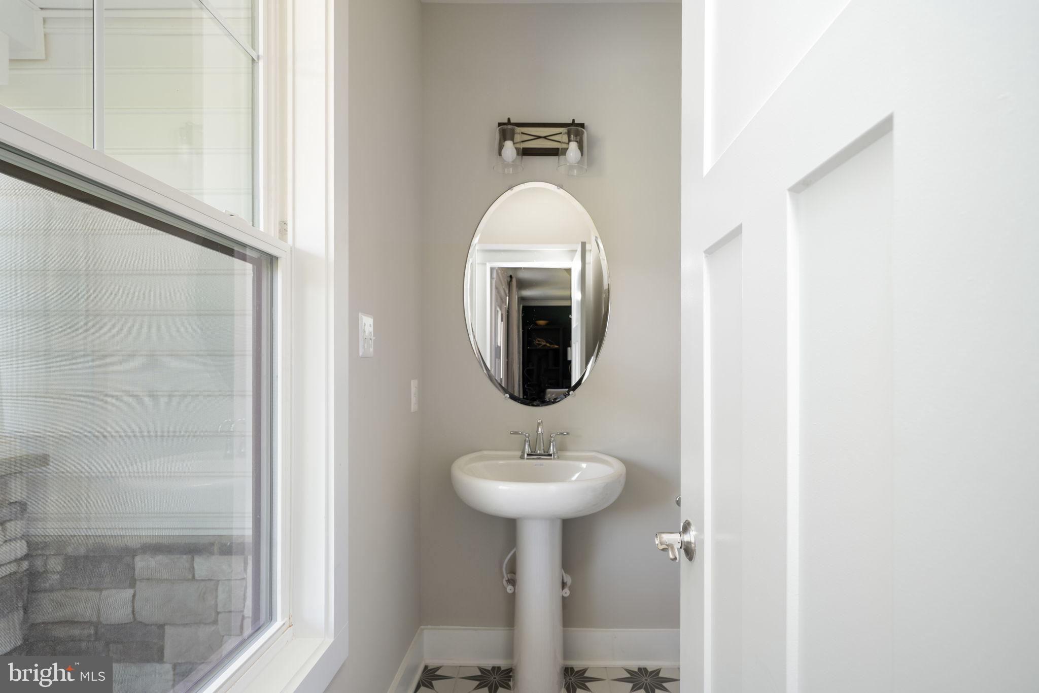 119 Juggins Road Stafford, VA 22556 - Photo 27 of 46 a bathroom with a sink and a mirror