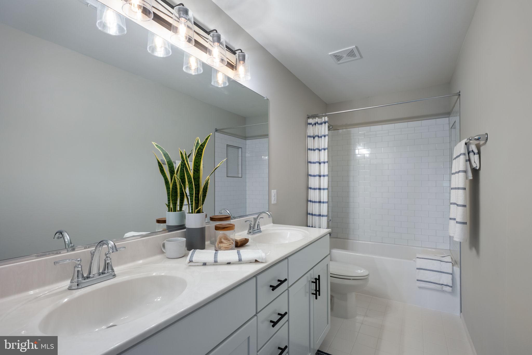 119 Juggins Road Stafford, VA 22556 - Photo 33 of 46 a bathroom with a double vanity sink toilet and shower