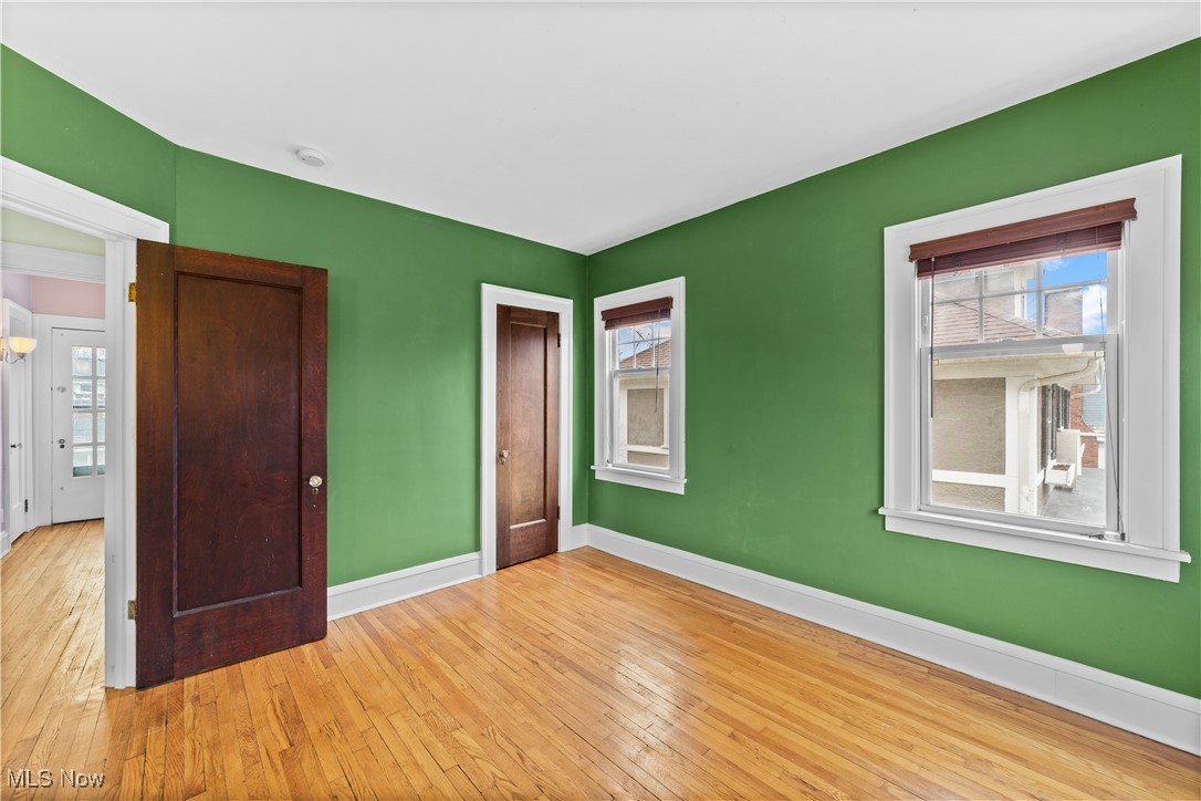 2891 Huntington Road Cleveland, OH 44120 - Photo 24 of 44 Unfurnished bedroom with hardwood / wood-style flooring and baseboards