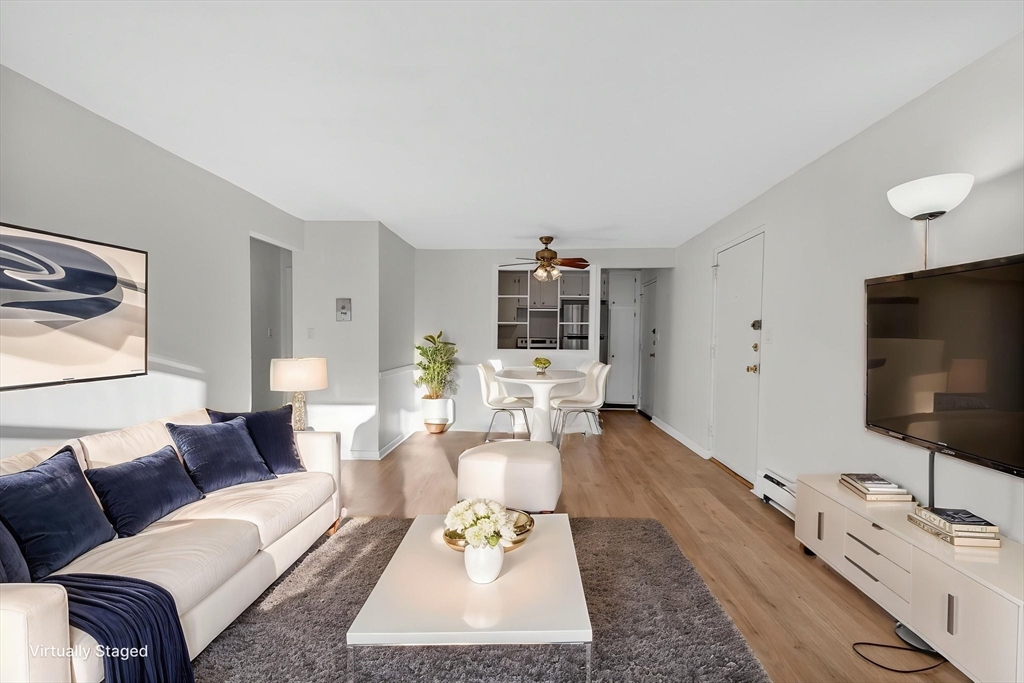 A1 Colonial Drive, Unit 10 Andover, MA 01810 - Photo 1 of 18 a living room with furniture and a flat screen tv
