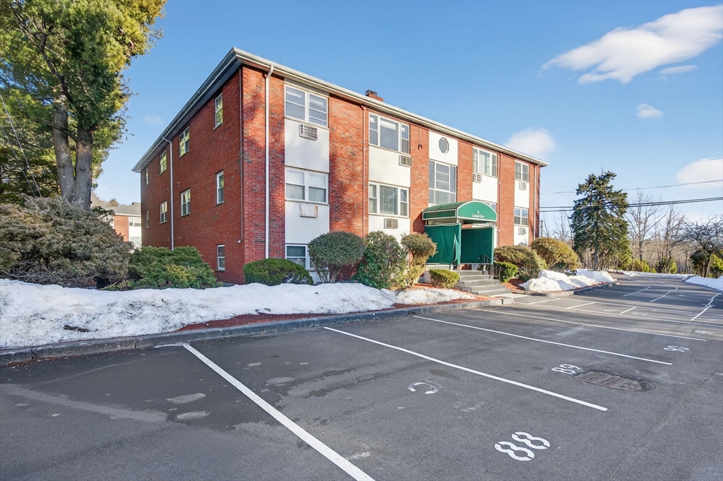 A1 Colonial Drive, Unit 10 Andover, MA 01810 - Photo 13 of 18 a front view of a house with a yard
