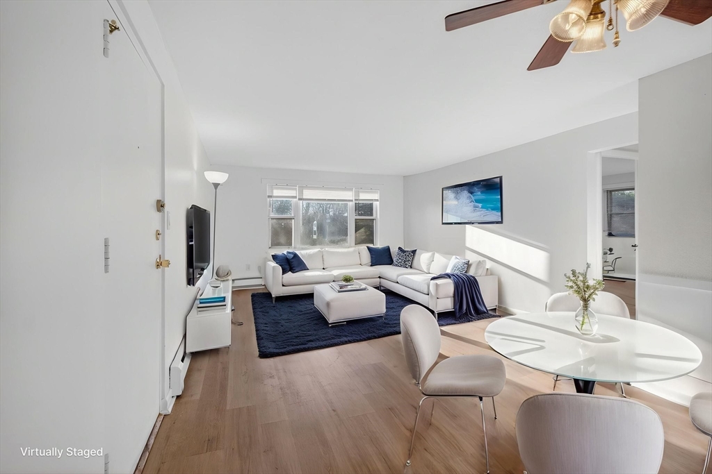 A1 Colonial Drive, Unit 10 Andover, MA 01810 - Photo 2 of 18 a living room with furniture and a wooden floor