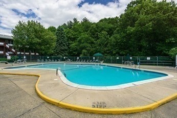 A1 Colonial Drive, Unit 10 Andover, MA 01810 - Photo 9 of 18 a view of a swimming pool with a yard