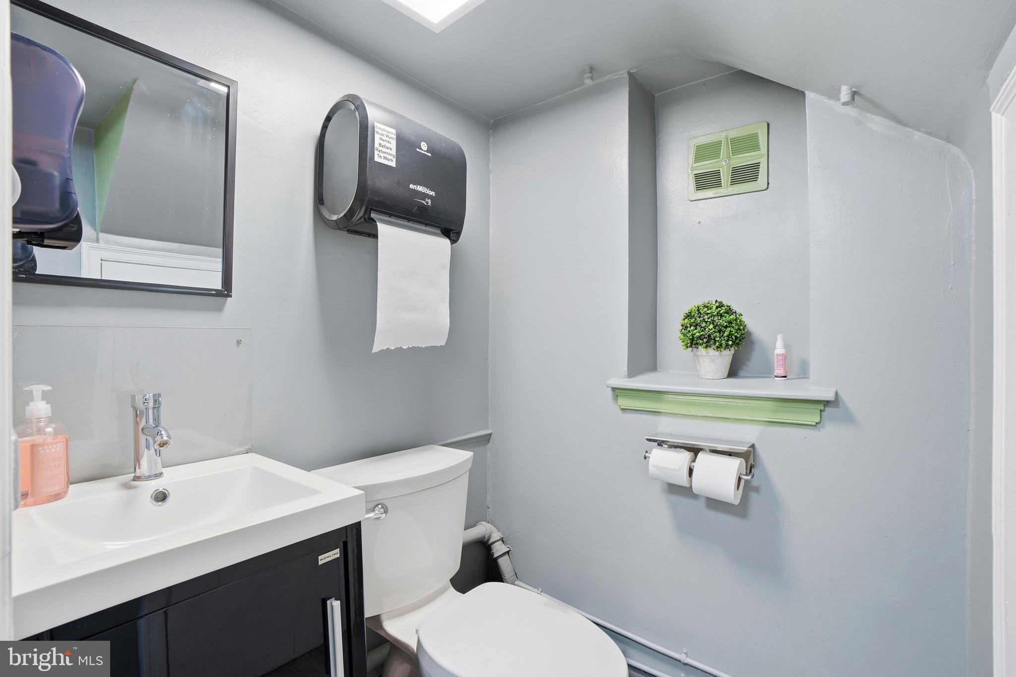 119 York Road Warminster, PA 18974 - Photo 37 of 53 a bathroom with a toilet a sink and mirror