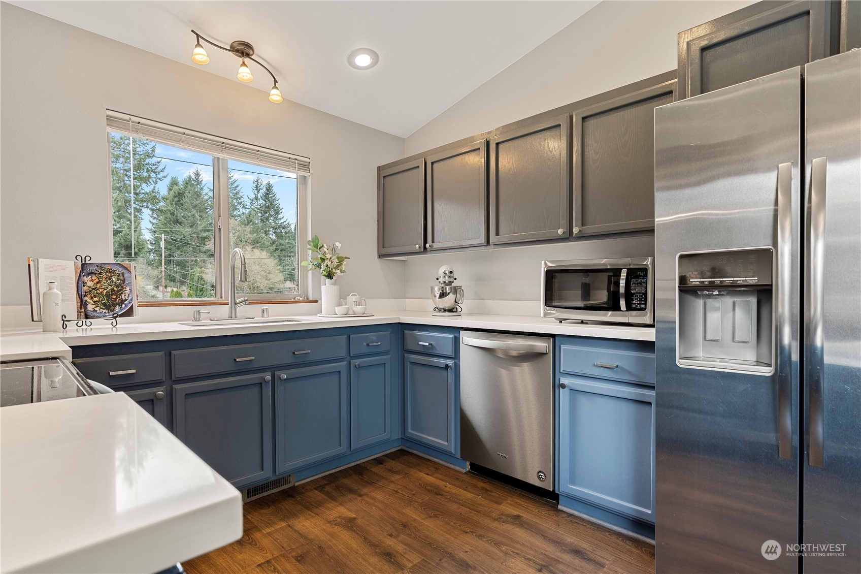 23613 23rd Avenue West Bothell, WA 98021 - Photo 13 of 36 a kitchen with a sink cabinets stainless steel appliances and a large window