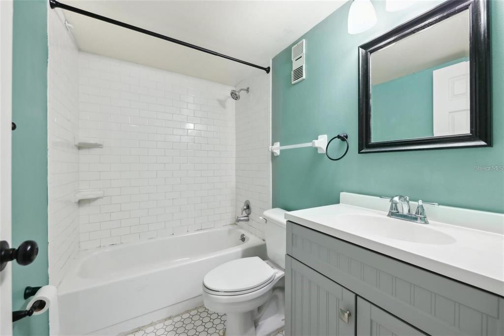 610 Cranes Way, Unit 207 Altamonte Springs, FL 32701 - Photo 19 of 27 a bathroom with a sink a toilet and a mirror