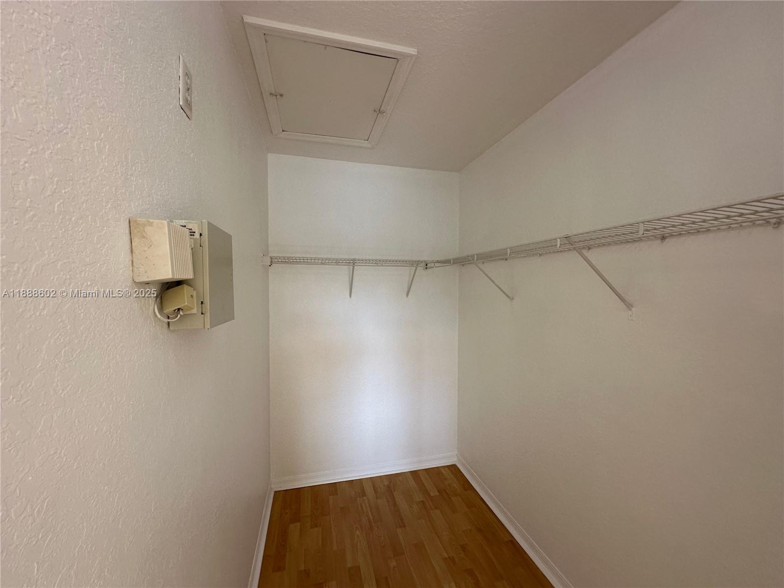 1260 Southeast 29th Street, Unit 20359 Homestead, FL 33035 - Photo 18 of 19 a view of a room with racks on the wall