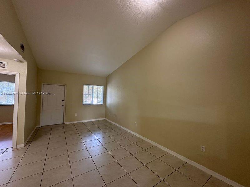 1260 Southeast 29th Street, Unit 20359 Homestead, FL 33035 - Photo 3 of 19 an empty room with windows