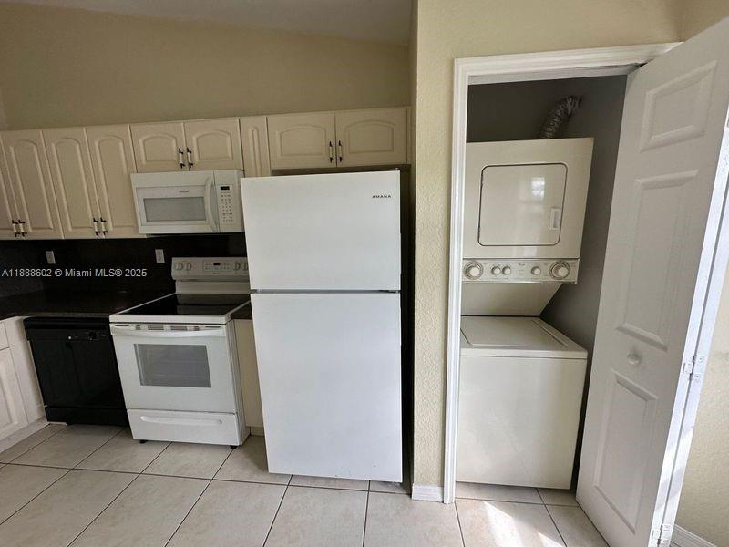 1260 Southeast 29th Street, Unit 20359 Homestead, FL 33035 - Photo 7 of 19 a kitchen with a refrigerator sink and cabinets
