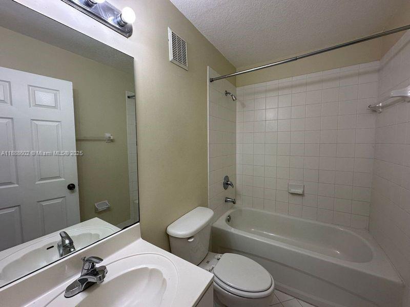 1260 Southeast 29th Street, Unit 20359 Homestead, FL 33035 - Photo 10 of 19 a bathroom with a sink a toilet and shower