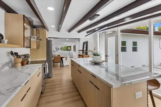 a large kitchen with stainless steel appliances granite countertop lots of counter top space