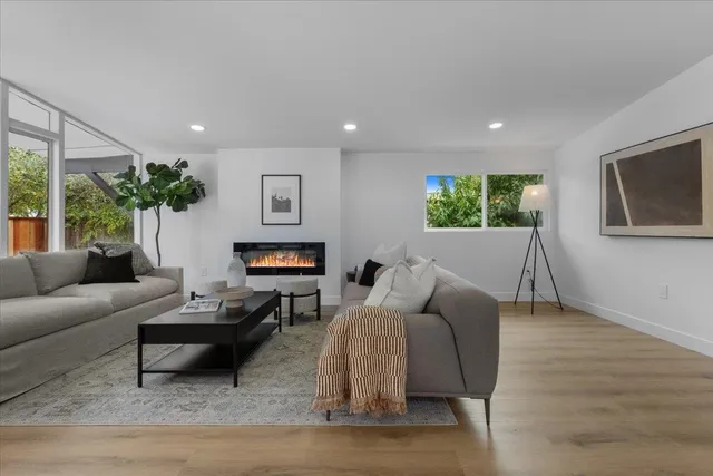 a living room with furniture or couch and a flat screen tv